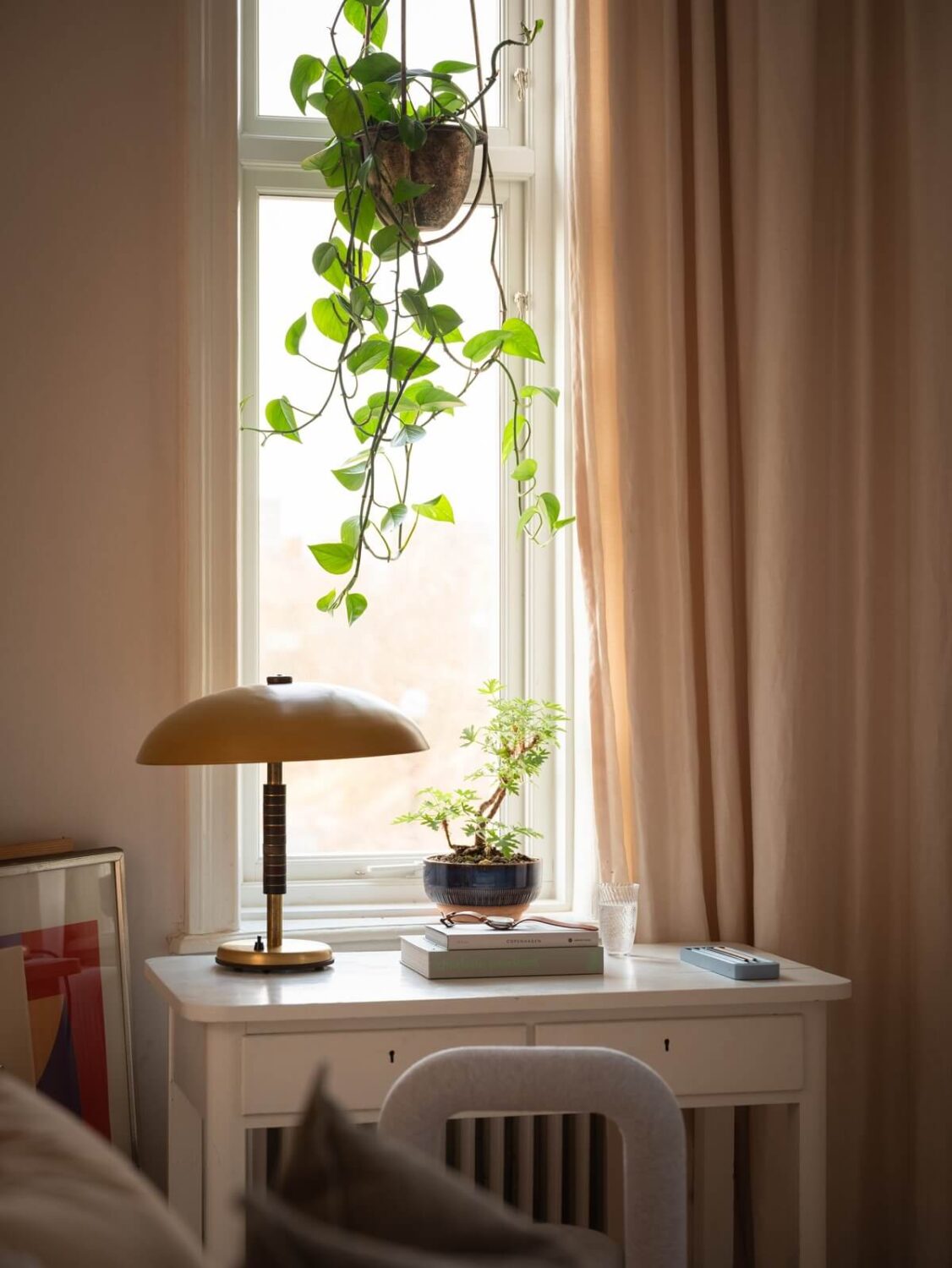 small white desk with yellow lamp