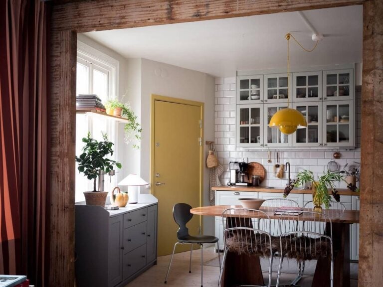 view into kitchen with wooden beams