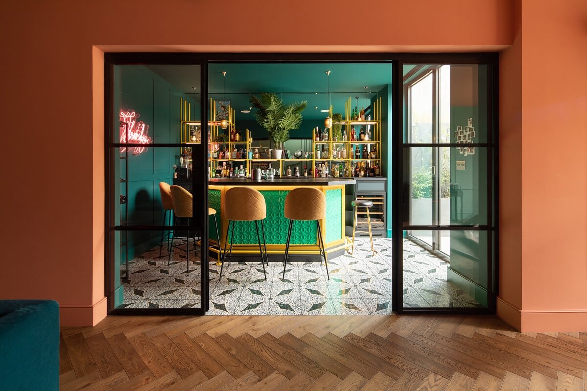 basement bar with terracotta wall and green ceiling