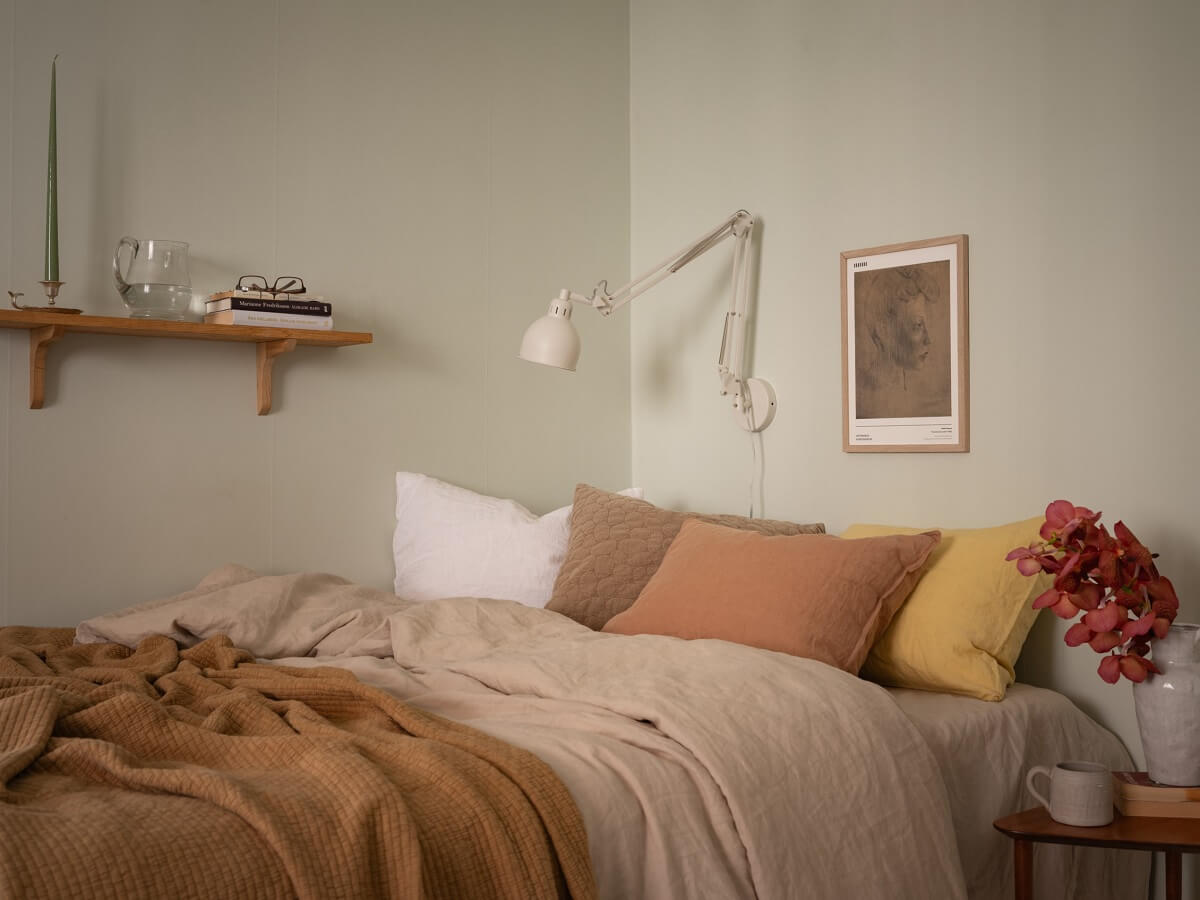 bed area with shelf in studio