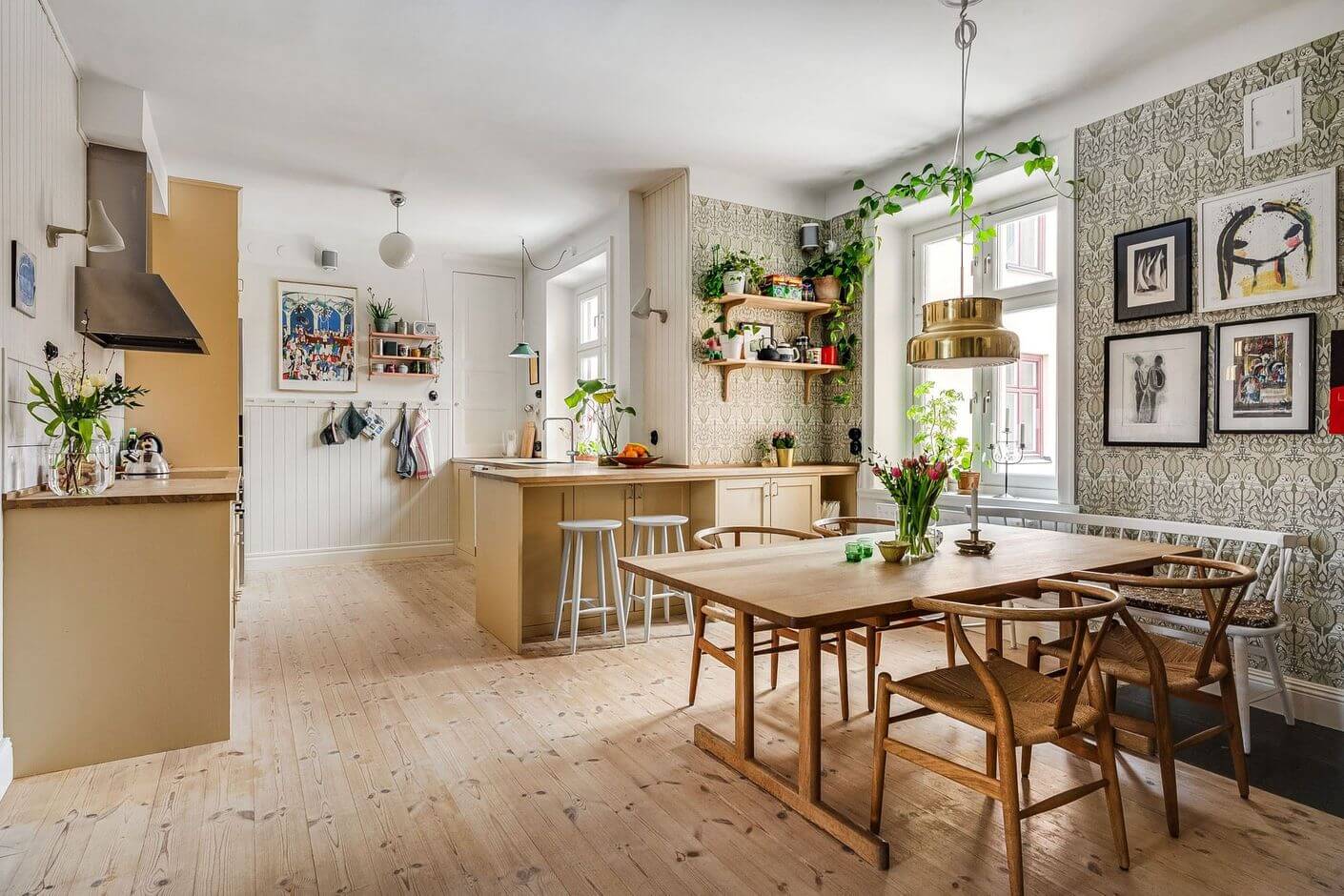 kitchen and dining space with wallpaper