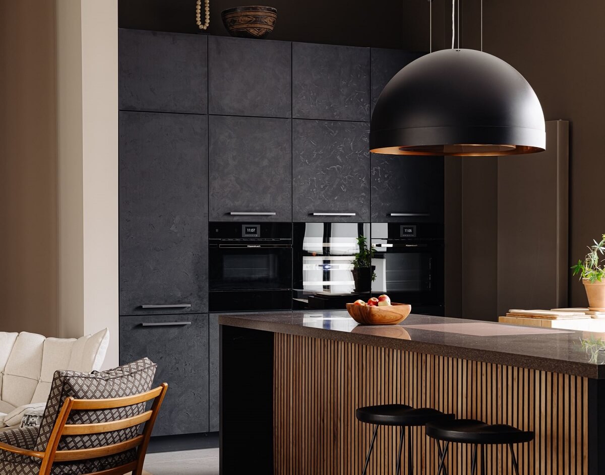 kitchen with large pendant and bar seating