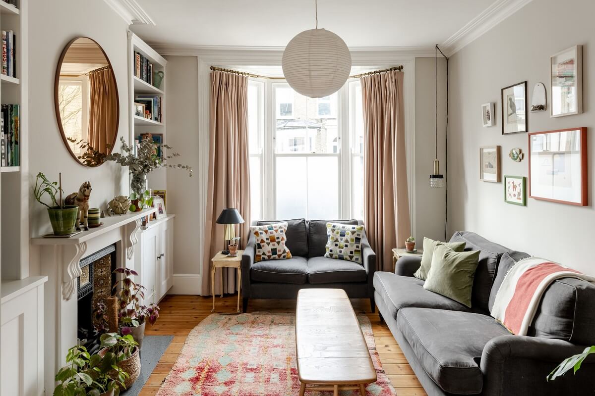 living room with bay window fireplace and pine floorboards