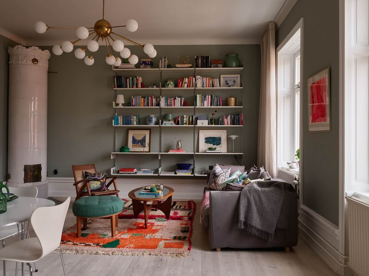 living room with bookshelves and fireplace