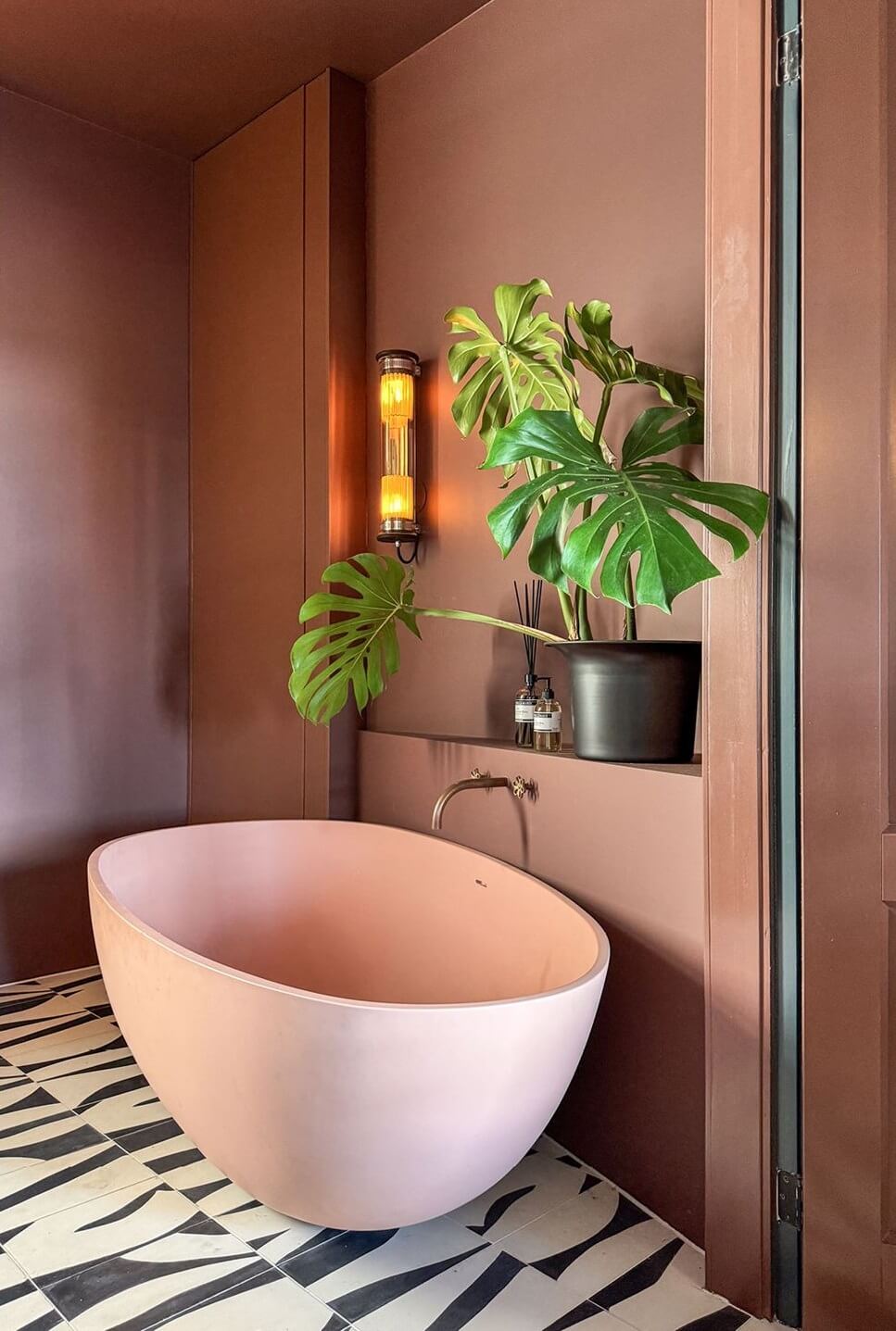 pink bath and graphic floor tiles