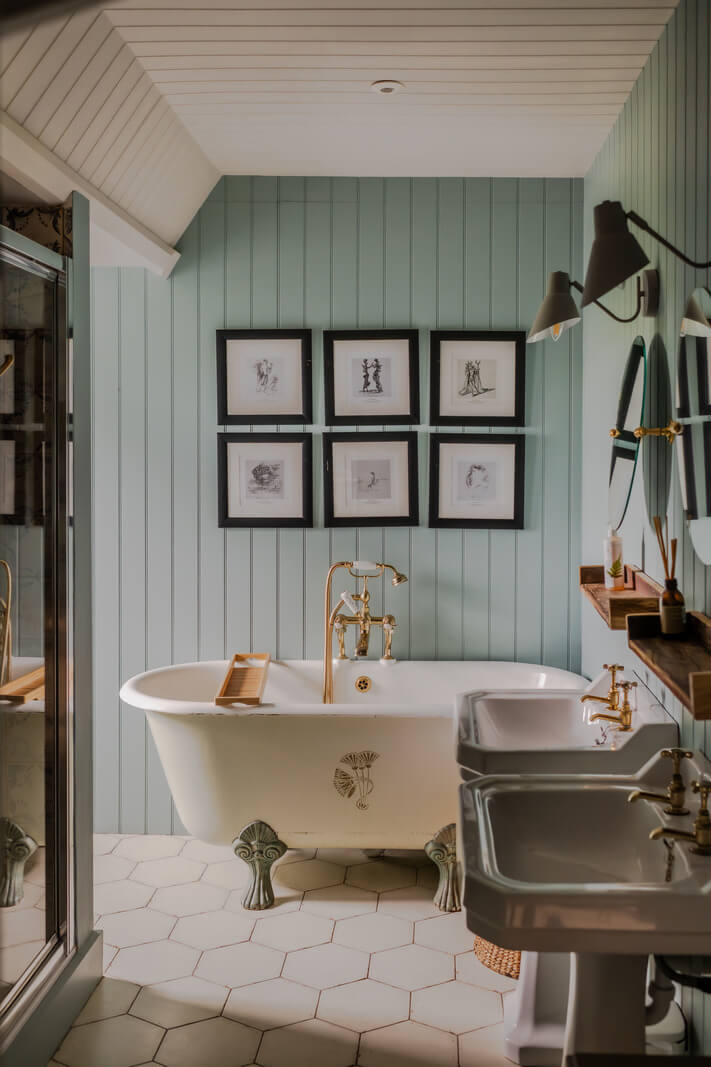 A Charming Gothic-Style Home with Original Details 26 bathroom with light blue tongue and groove paneling nordroom