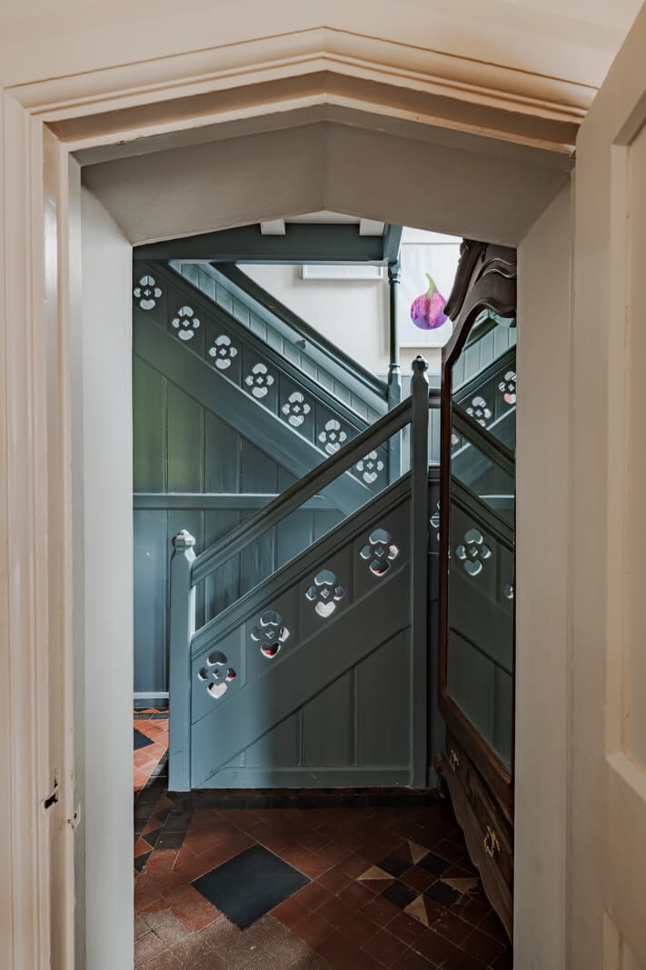 A Charming Gothic-Style Home with Original Details 16 blue staircase nordroom