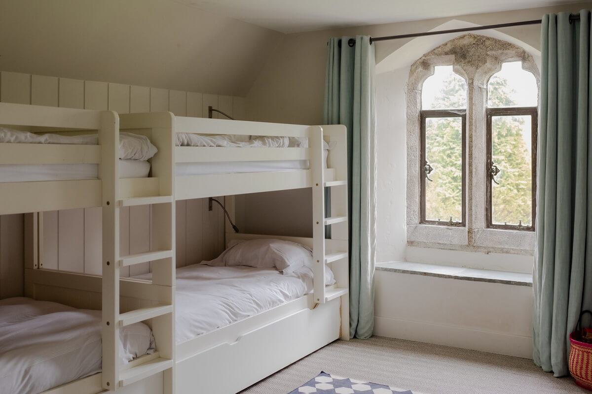 A Charming Gothic-Style Home with Original Details 23 bunk beds white bedroom
