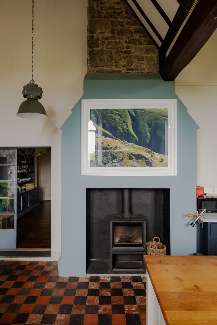 A Charming Gothic-Style Home with Original Details 9 checkerboard floor and wood burner in kitchen historic house nordroom