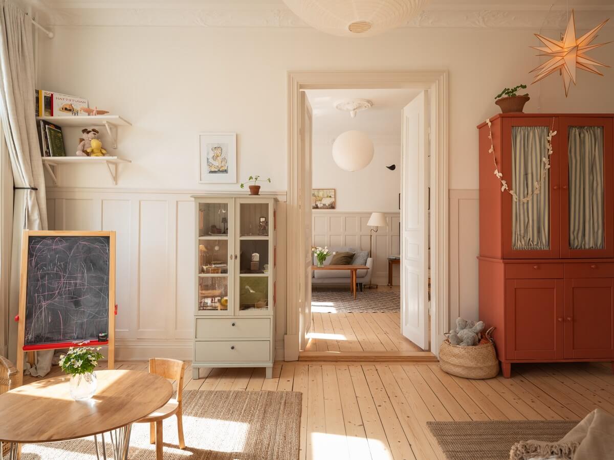 Light-Filled Rooms in a Historic Gothenburg Apartment 13 childrens room with wooden floor and red wardrobe