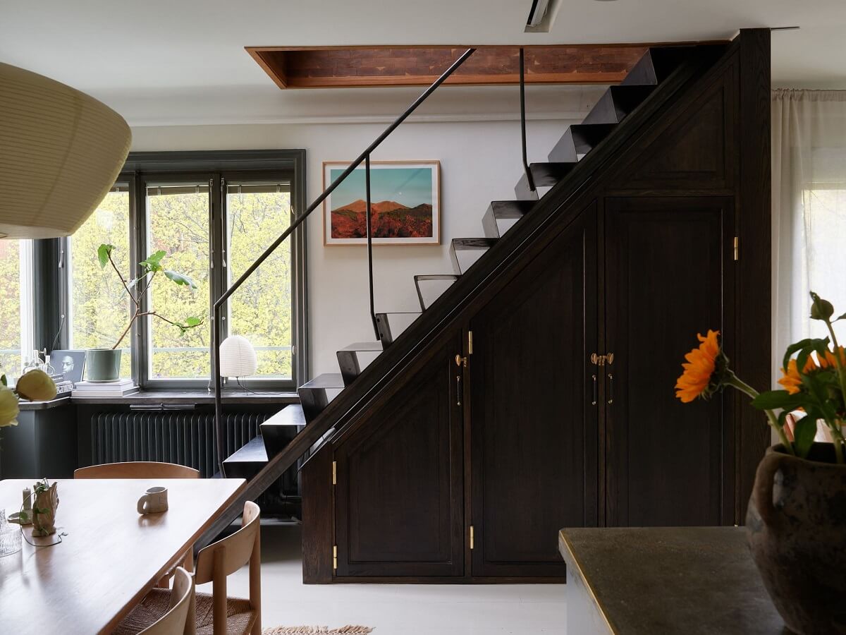 dark staircase with storage