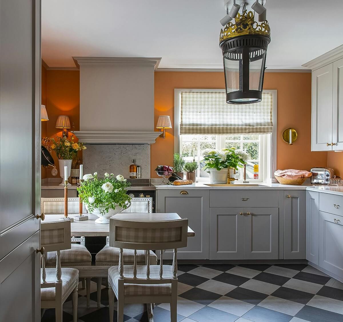gray kitchen orange wall luxurious summer house sweden nordroom