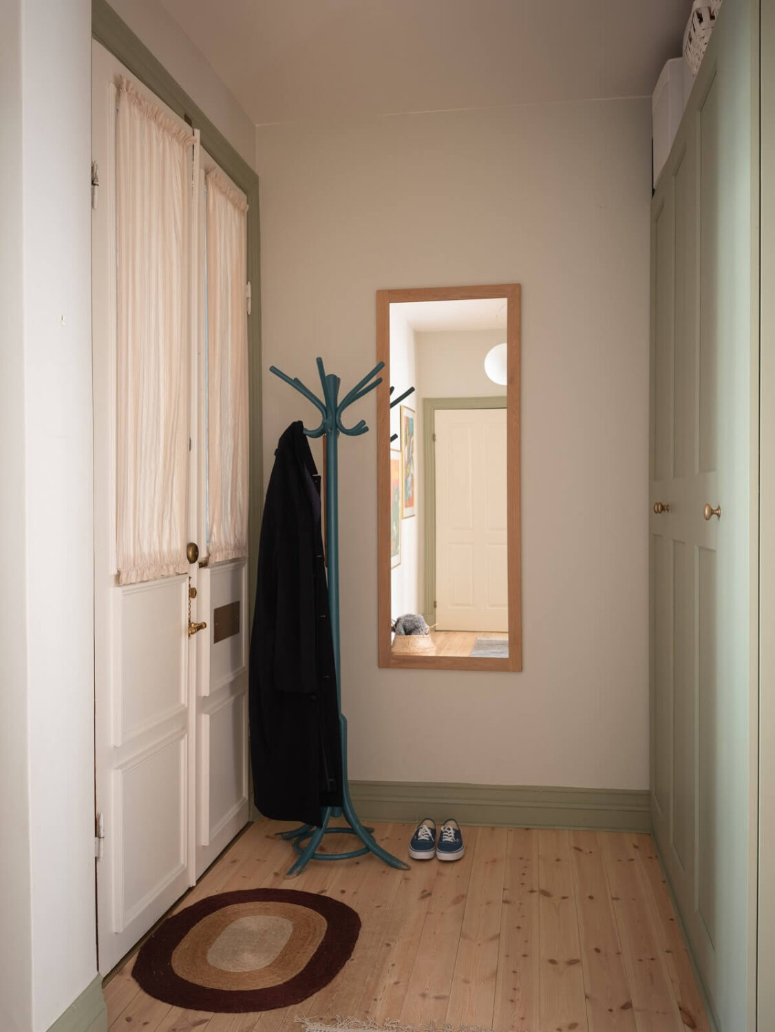 Light-Filled Rooms in a Historic Gothenburg Apartment 22 hallway with built in wardrobes