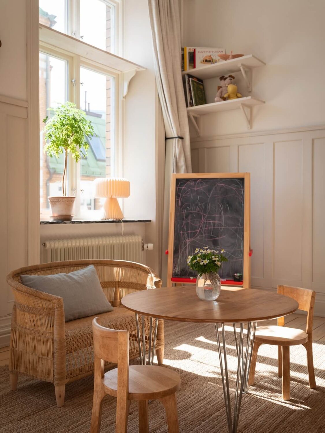 Light-Filled Rooms in a Historic Gothenburg Apartment 11 kids bedroom table and large window