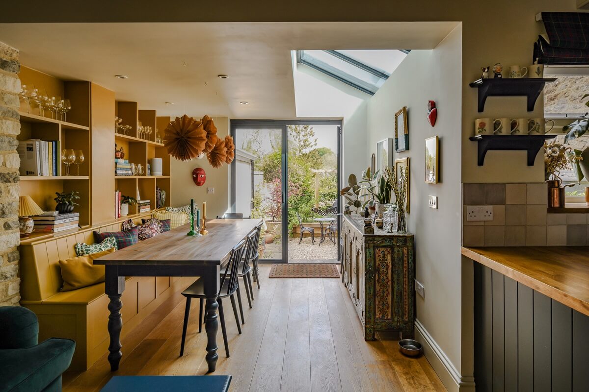 kitchen and dining room with skylight