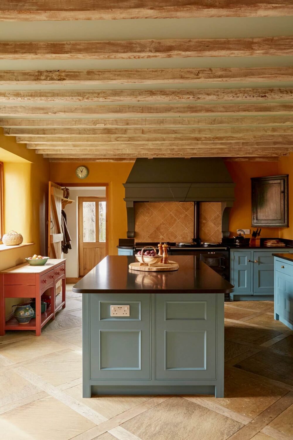 kitchen with island and warm yellow wall color nordroom