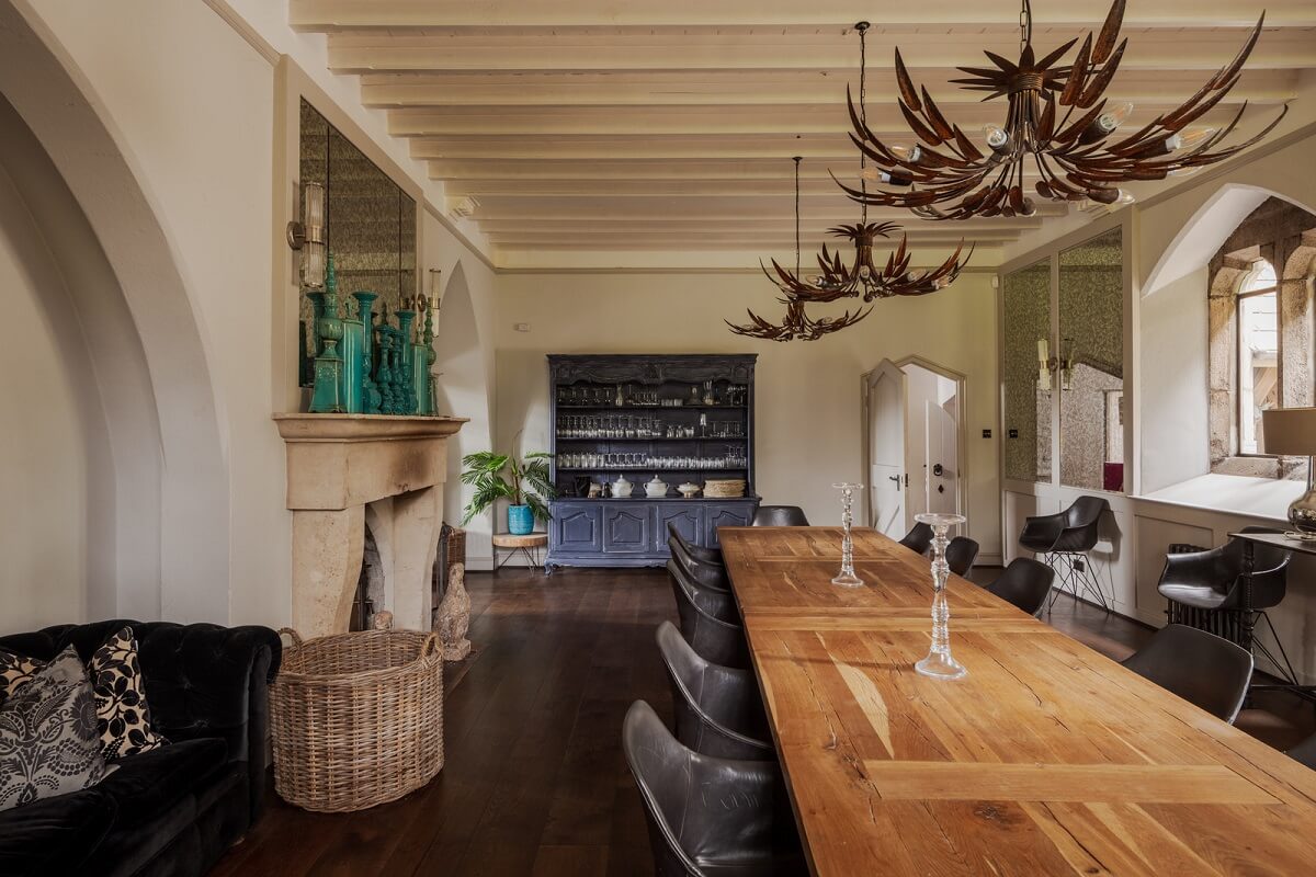 A Charming Gothic-Style Home with Original Details 12 large dining room with wooden ceiling and fireplace nordroom