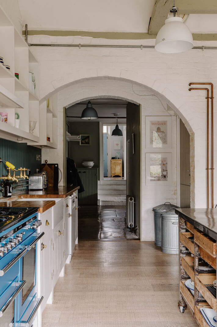 large kitchen with arched doorway