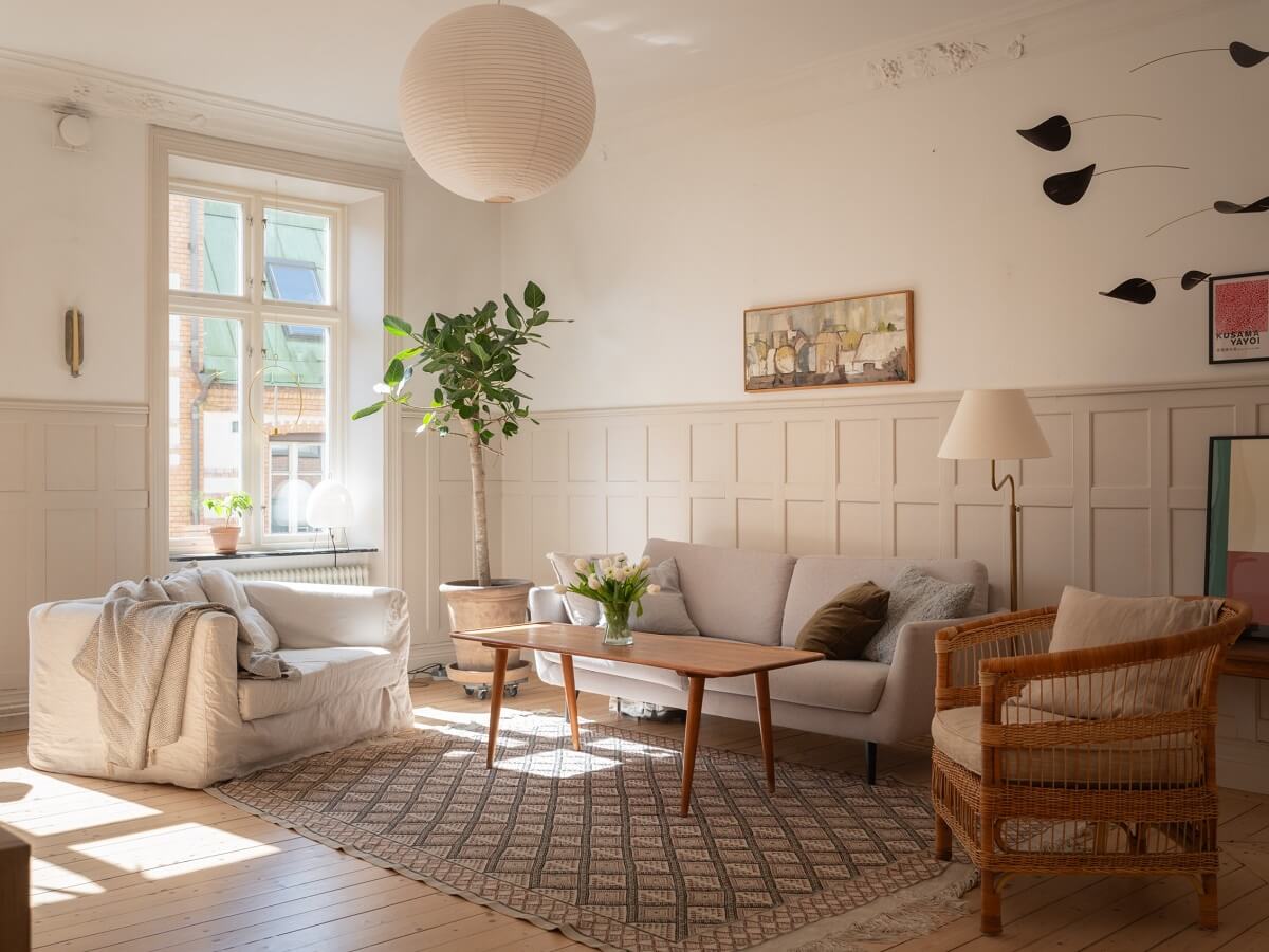 Light-Filled Rooms in a Historic Gothenburg Apartment 3 large windows in serene living room