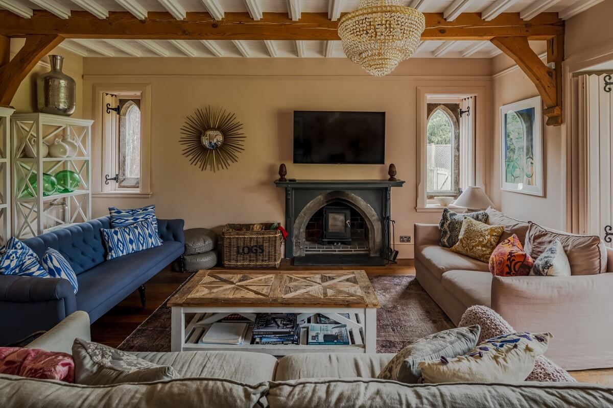 A Charming Gothic-Style Home with Original Details 2 light pink sitting room with wooden ceiling nordroom