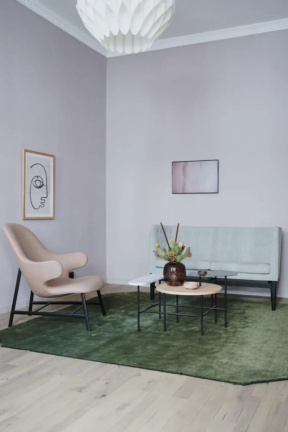 minimalistic living room with green rug