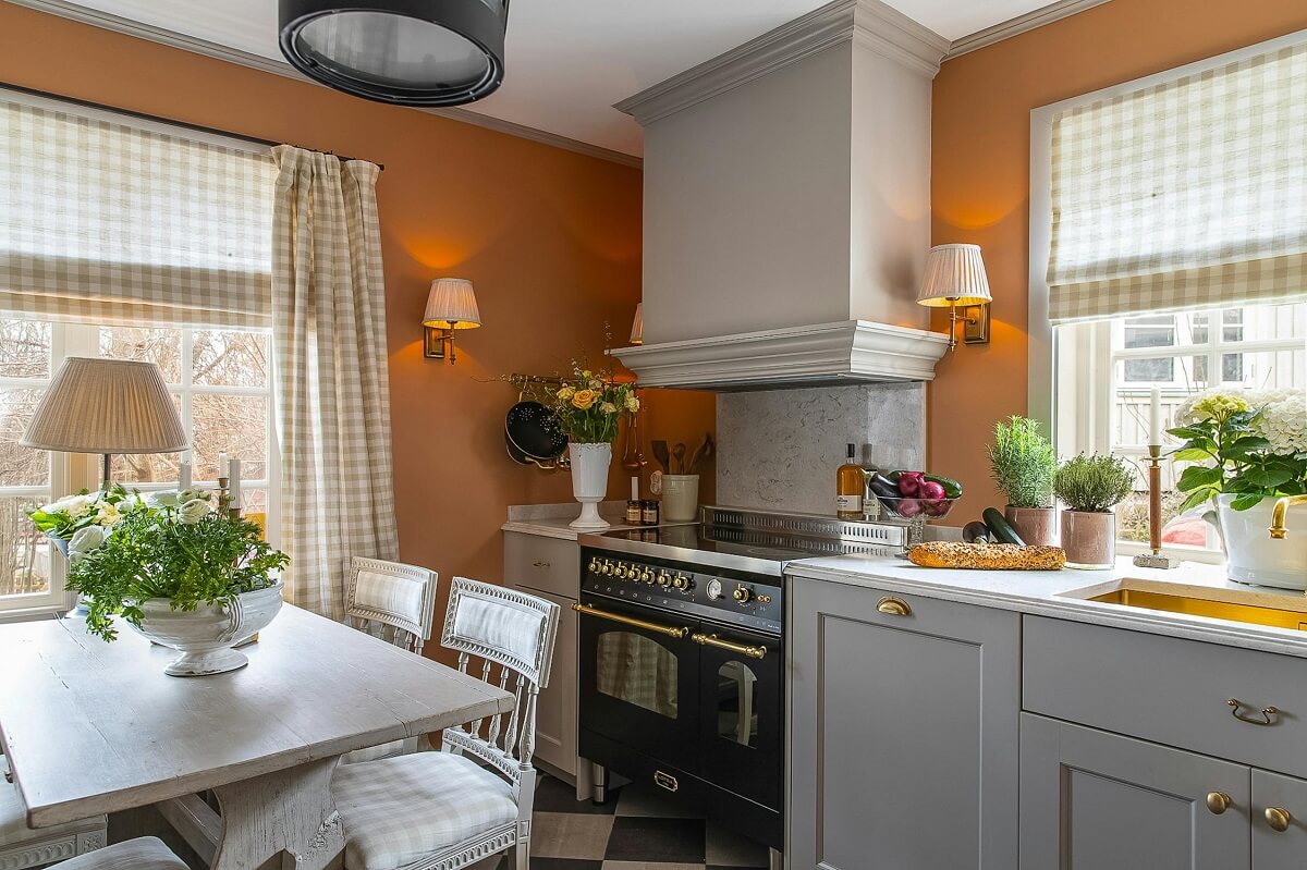 orange wall kitchen luxurious summer house sweden nordroom