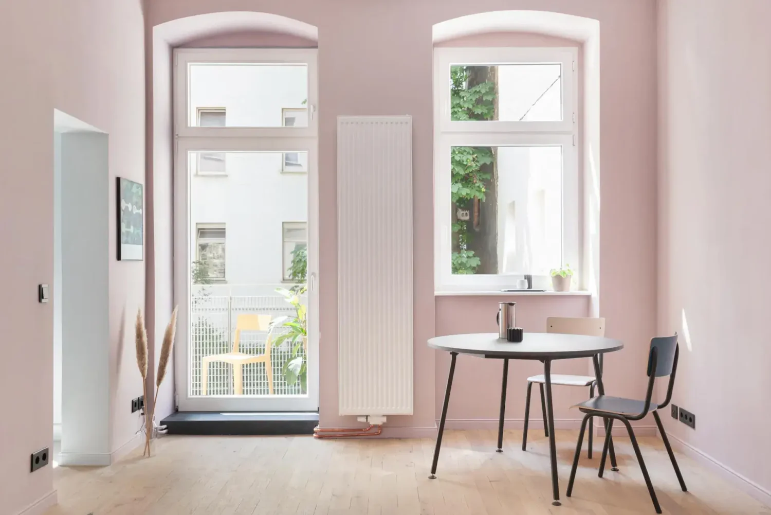 pink dining room with balcony