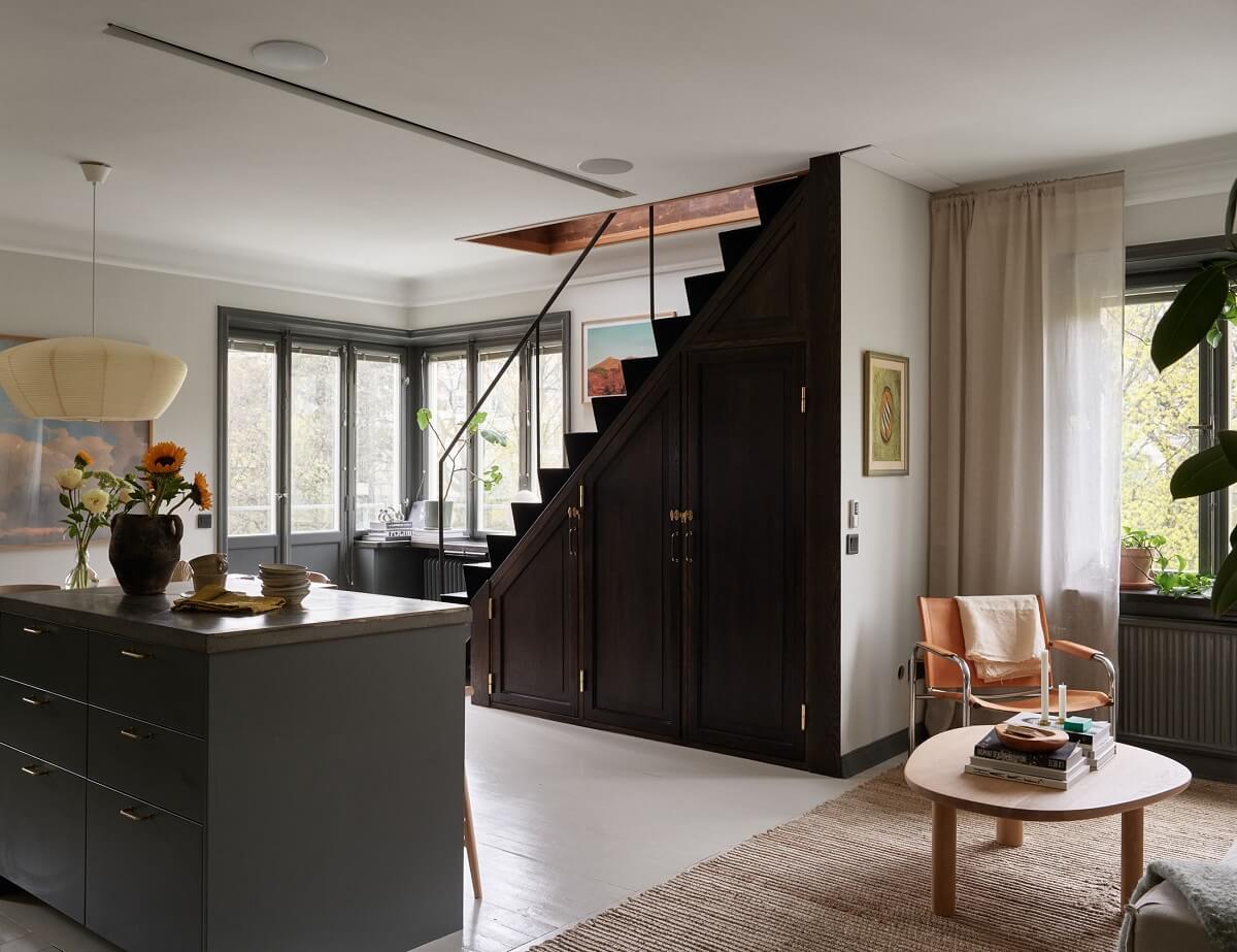 staircase with cabinets underneath