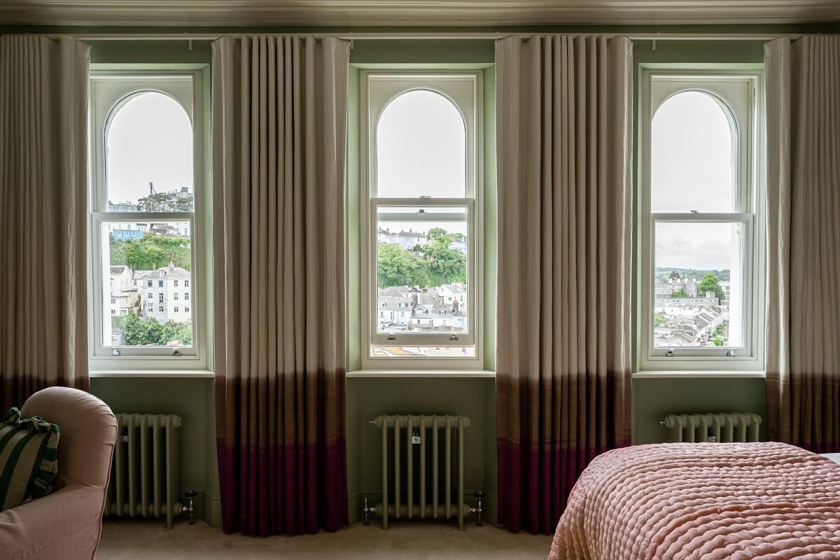 bedroom with arched windows