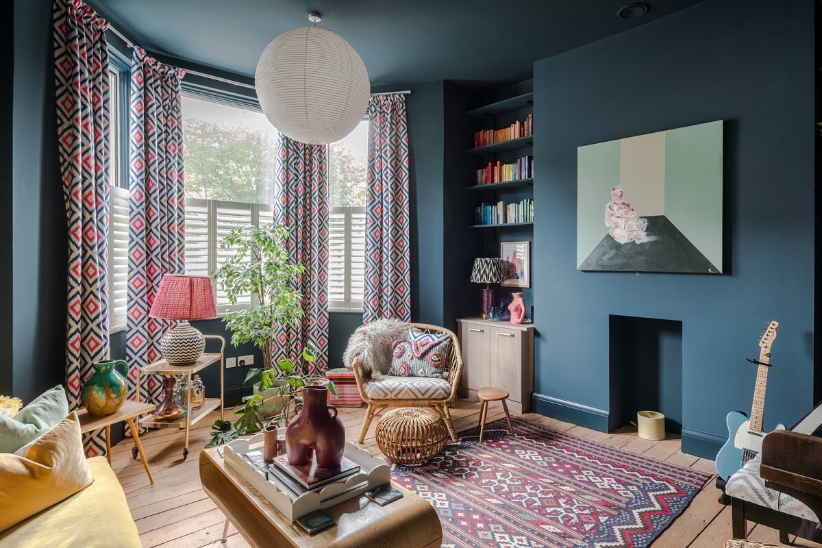 blue sitting room with bookshelves