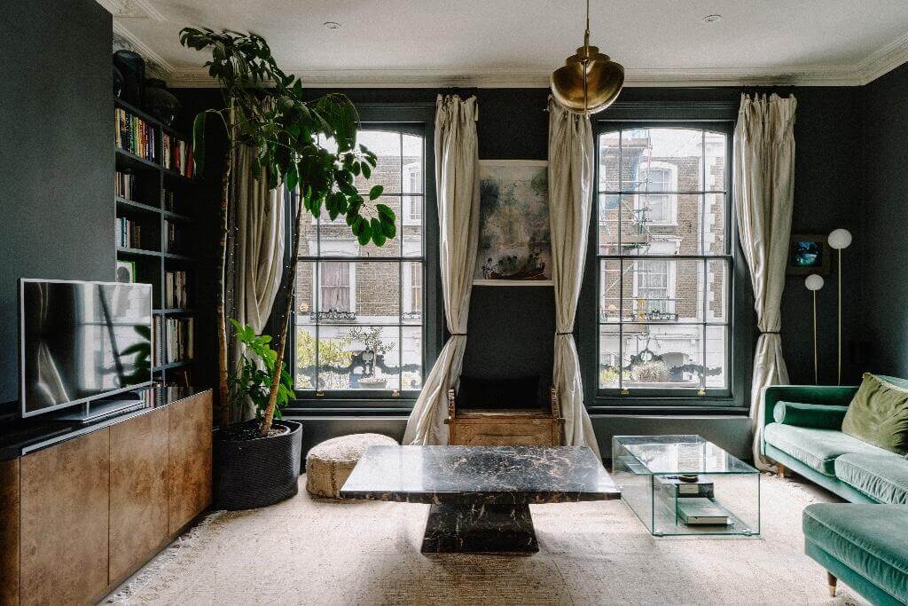 A Historic London Home with Contemporary Interiors 10 moody living room with green sofa