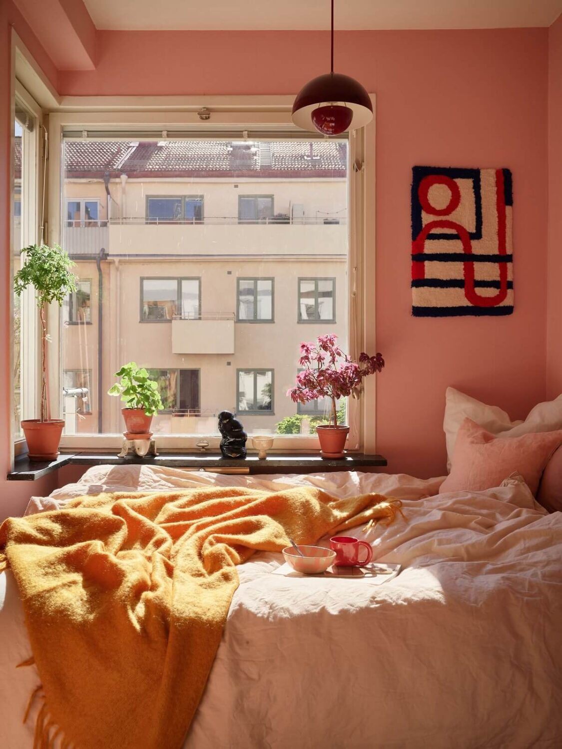 sunny pink bedroom with ochre yellow throw nordroom
