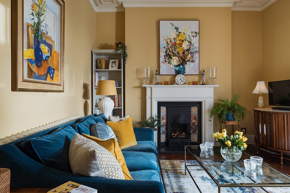 yellow living room with blue sofa