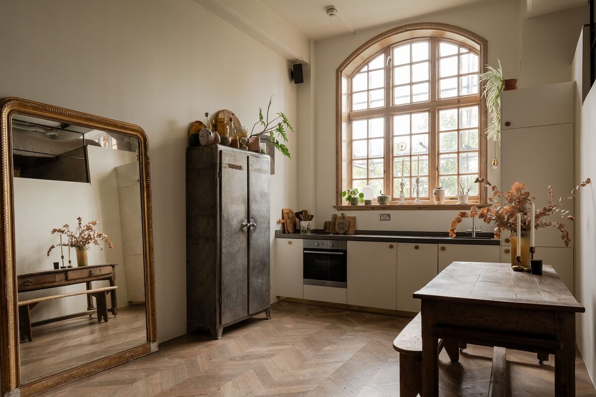 kitchen with large arched window and mirror