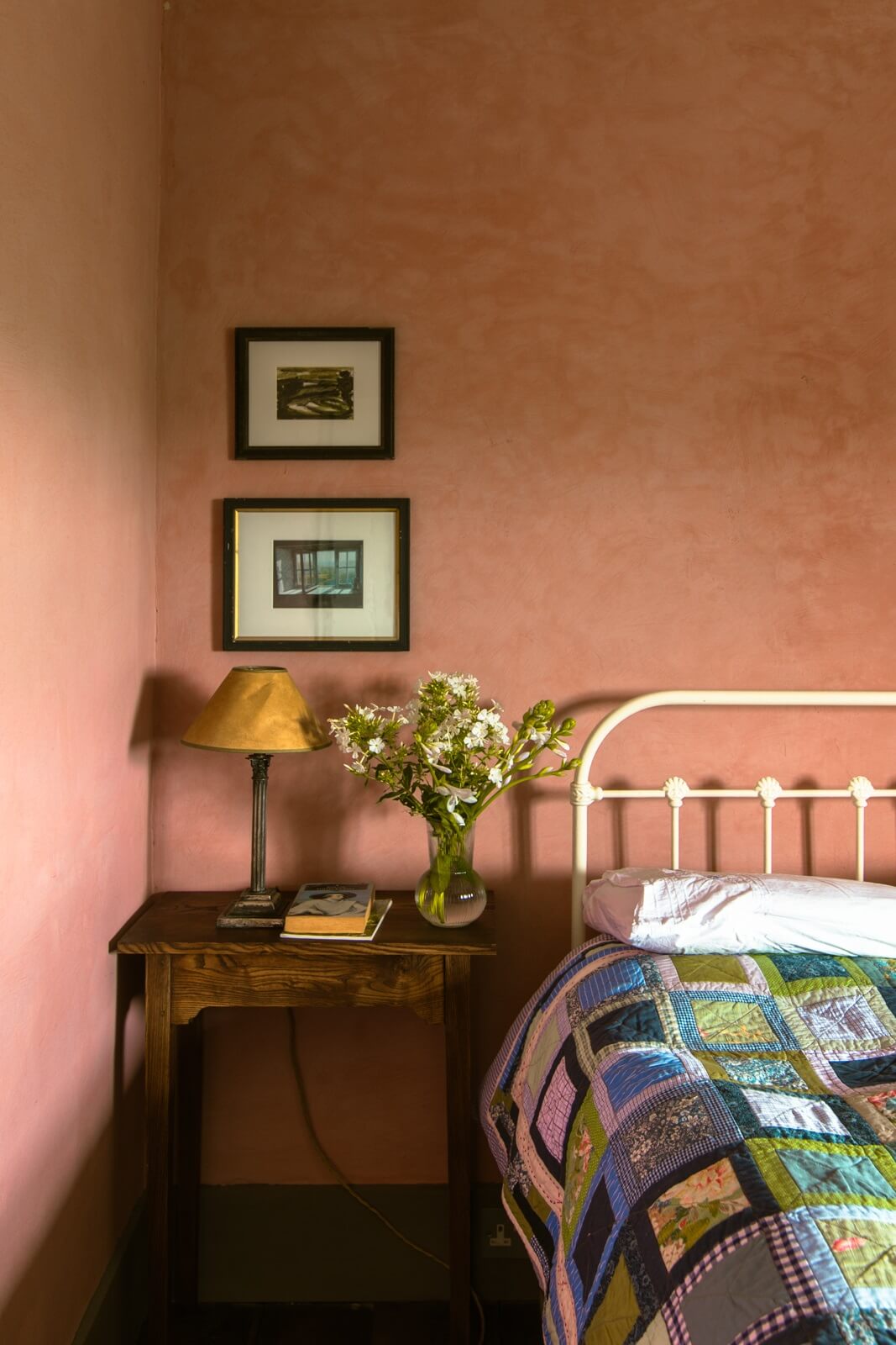 pink plaster walls nightstand bedroom