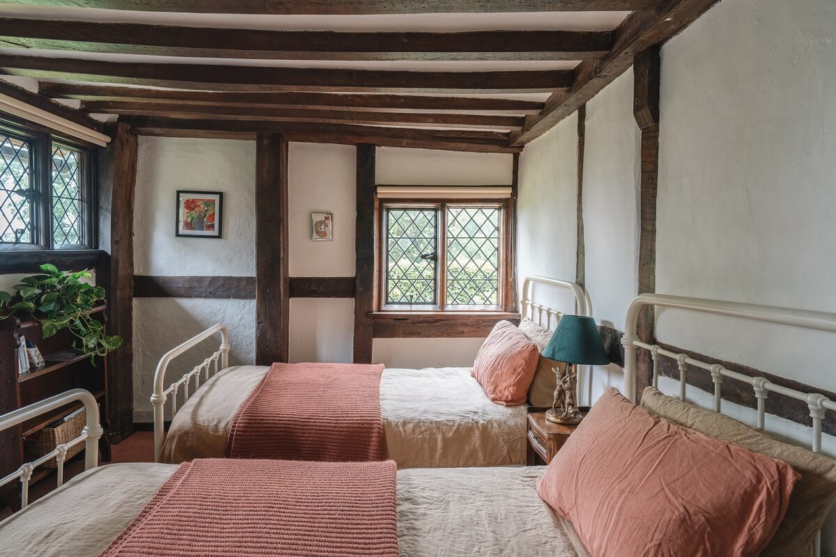 twin bedroom with exposed beams