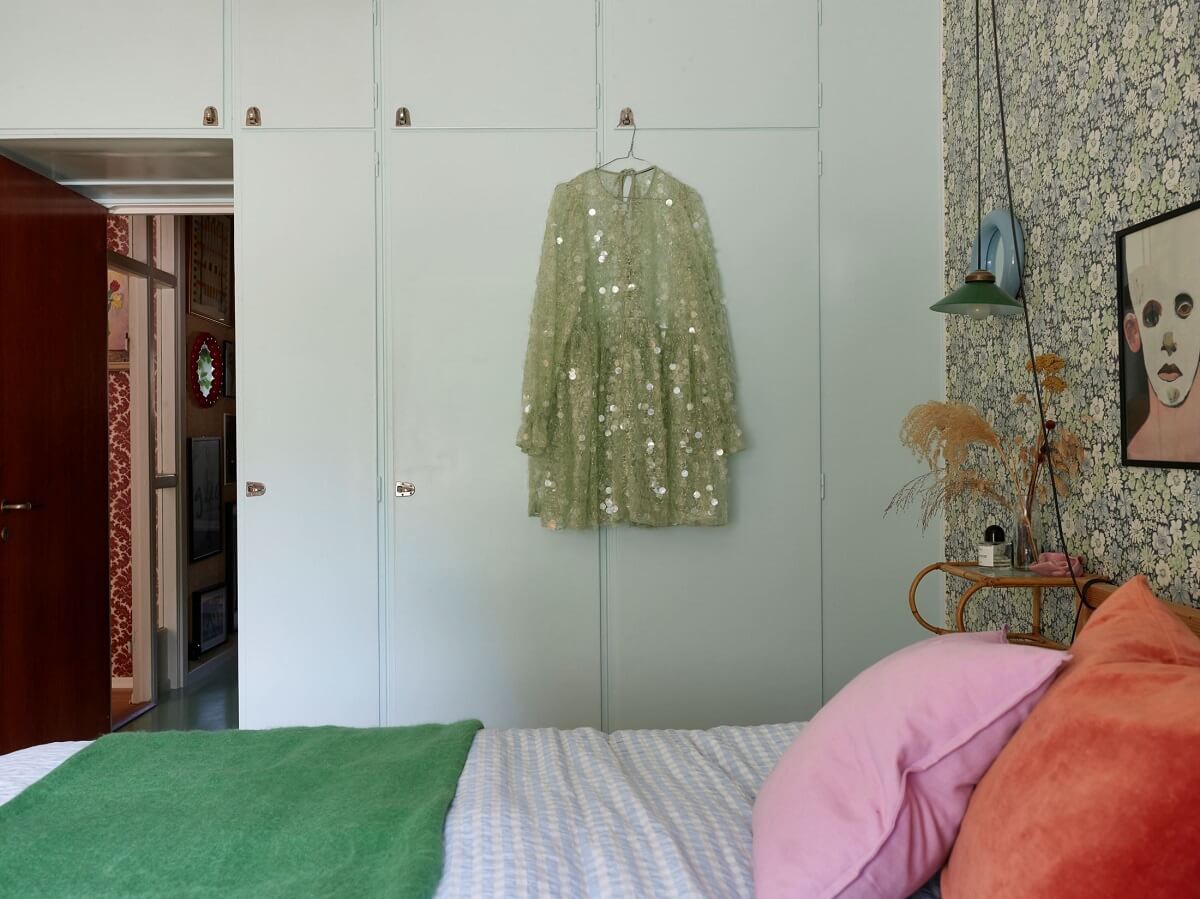 bedroom with wallpaper and light blue wardrobes nordroom