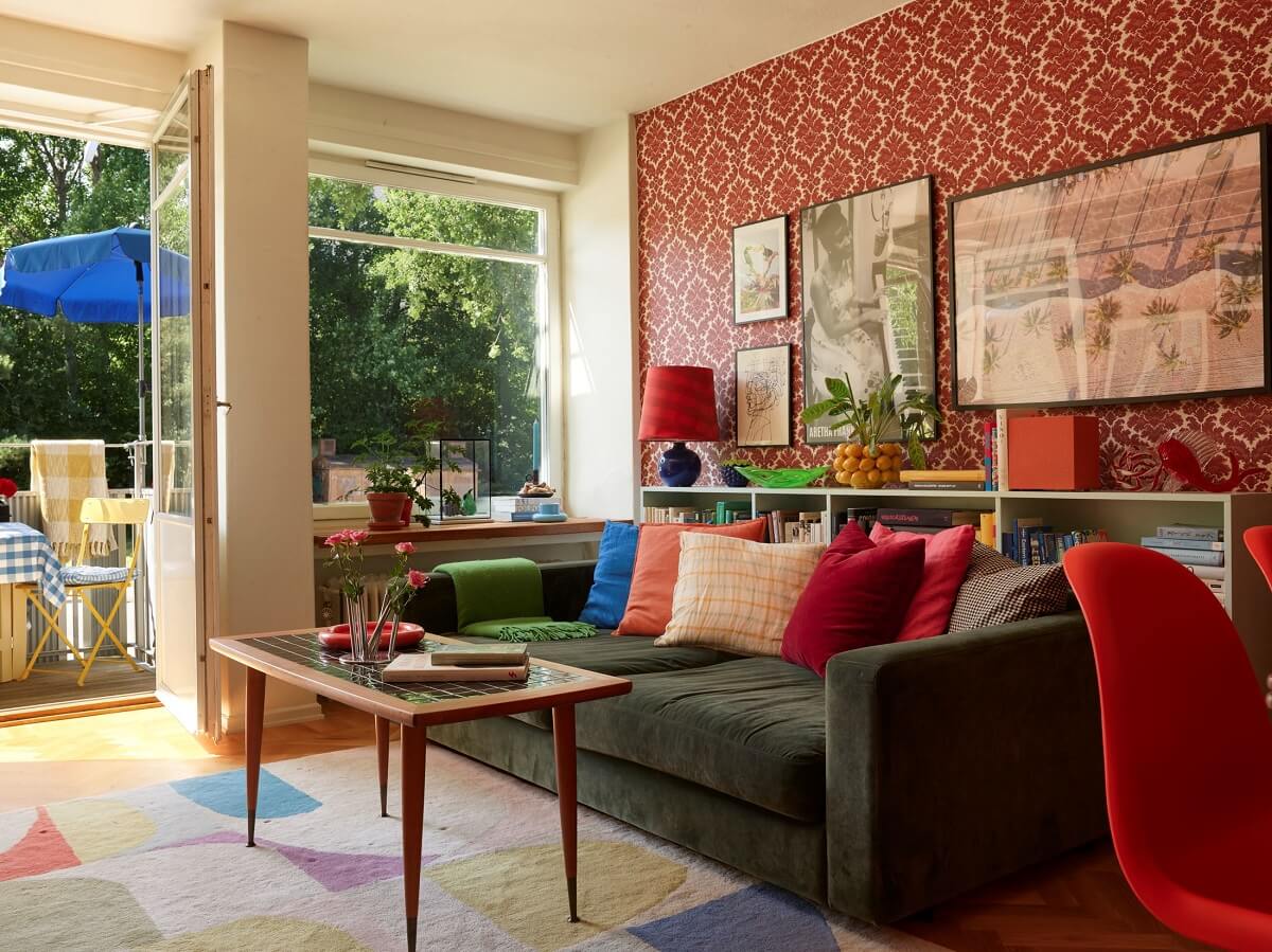 cheerful living room with green sofa and colorful textiles