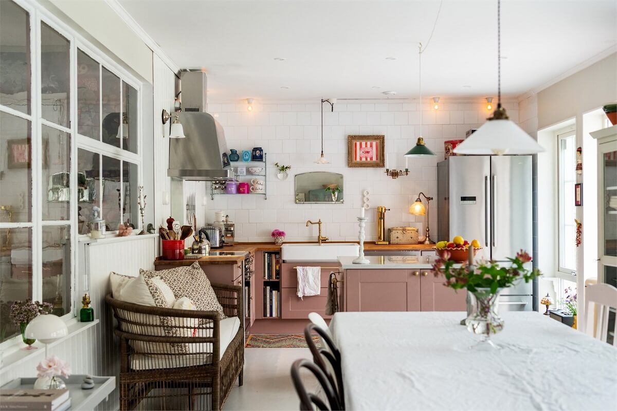 cozy pink kitchen with bench and dining table