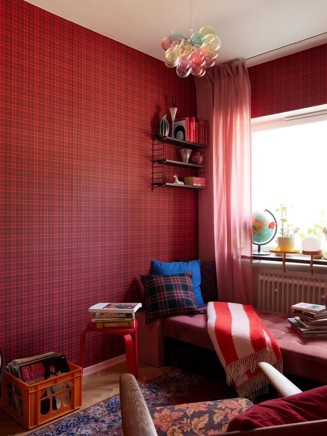 home office with red wallpaper and daybed in front of the window nordroom