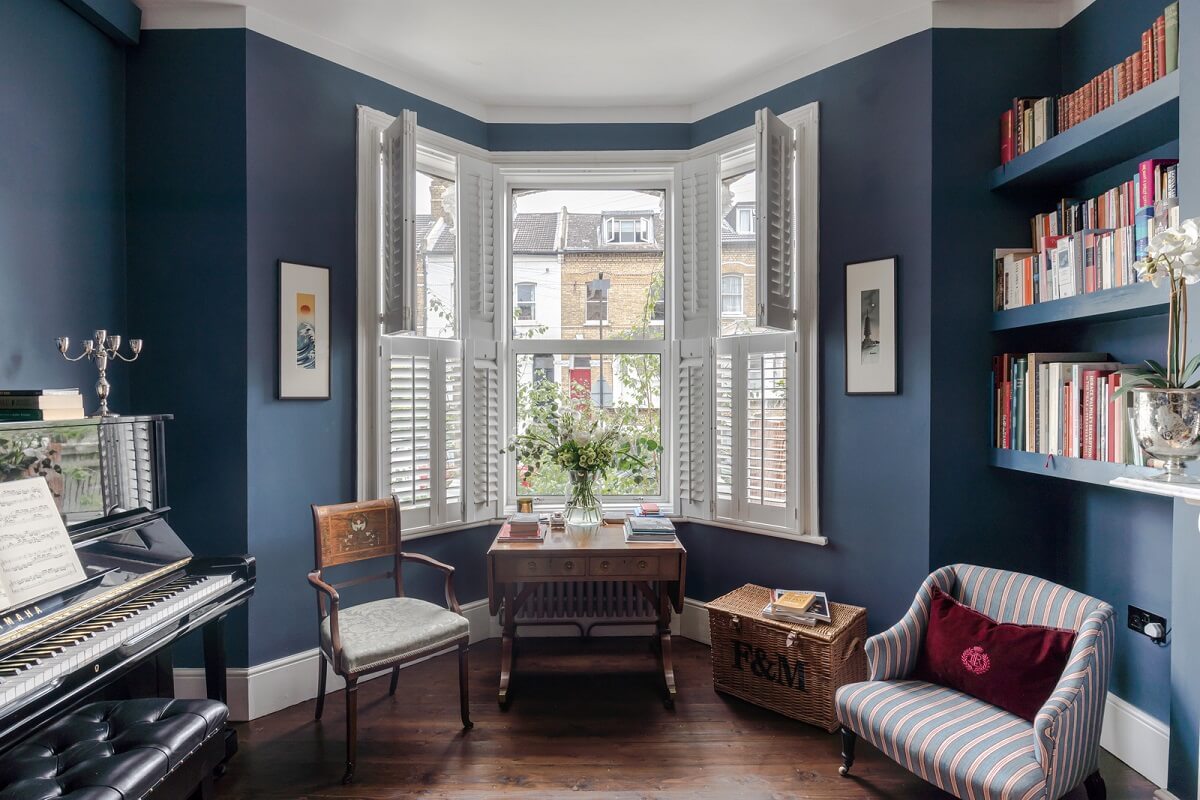 living room with bay window painted in hicks blue by little greene nordroom