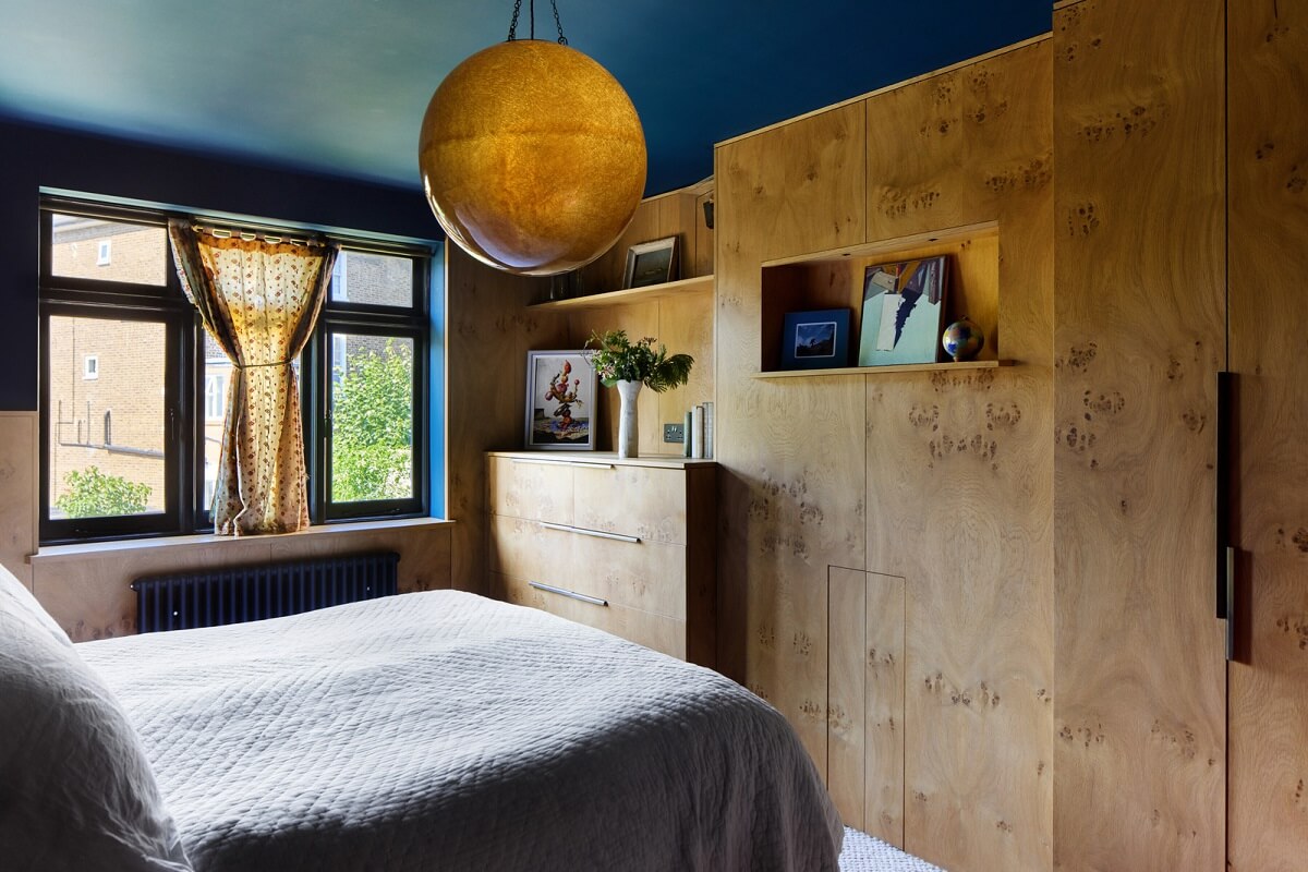 master bedroom blue ceiling wooden wardrobes