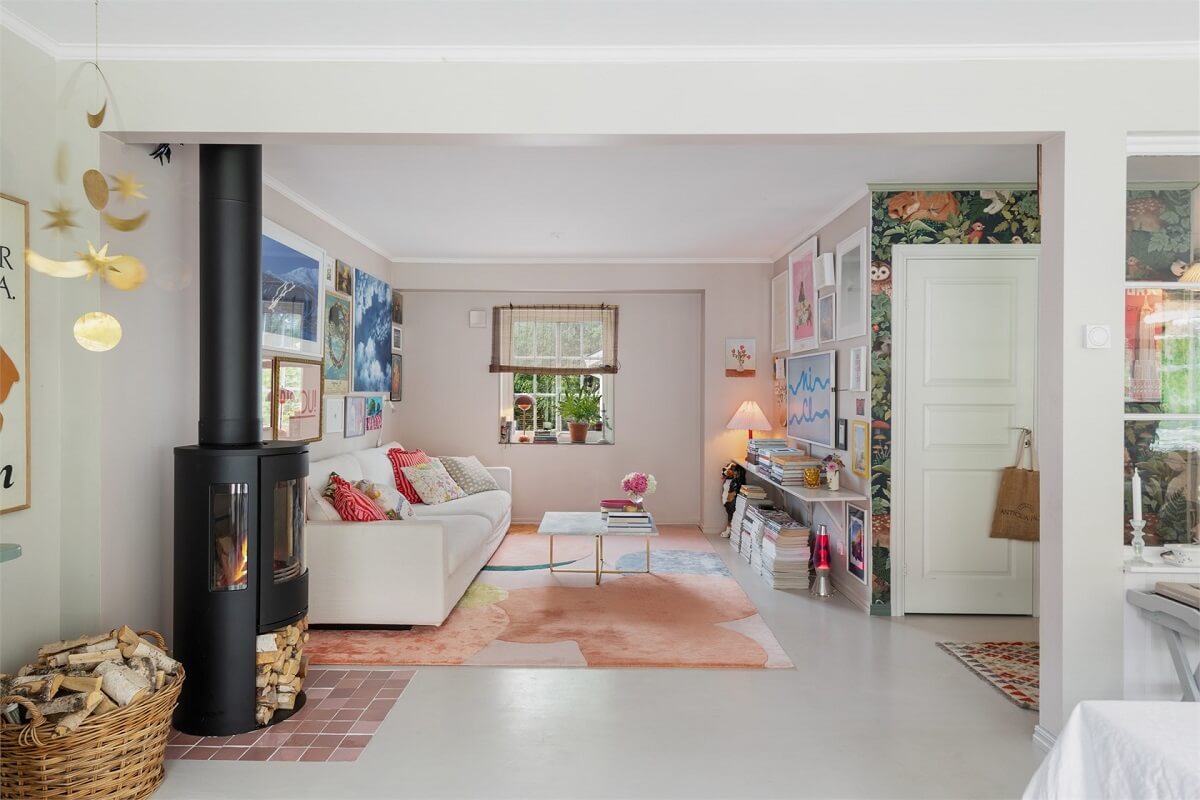 A Bright Open-Plan Swedish Home with a Pink Kitchen 1 open plan light colored living room
