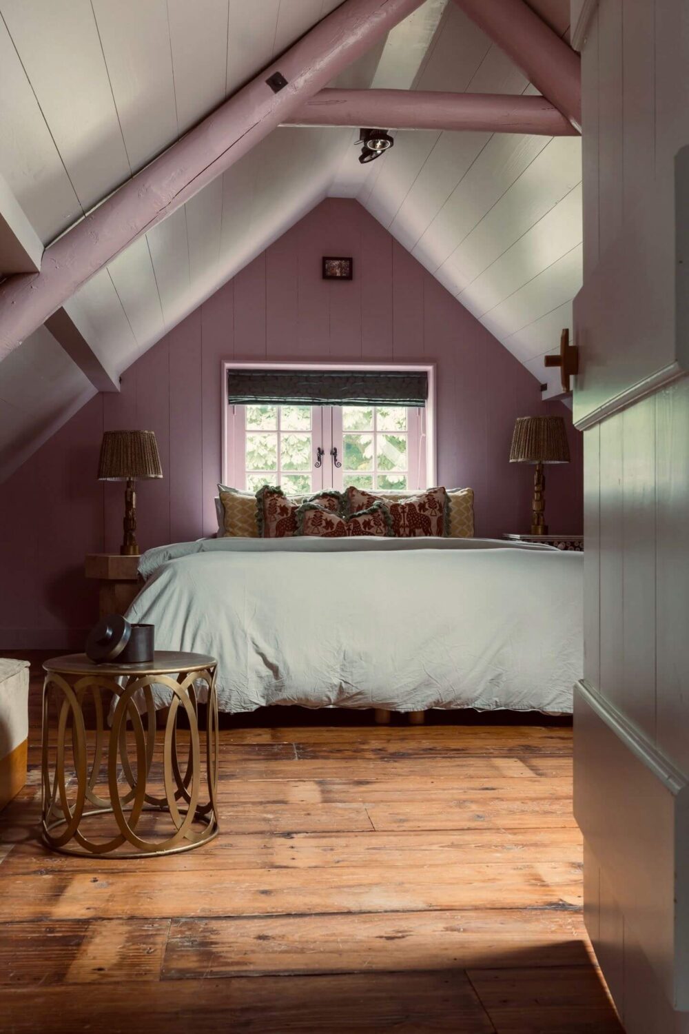 attic bedroom wooden floor purple accent wall
