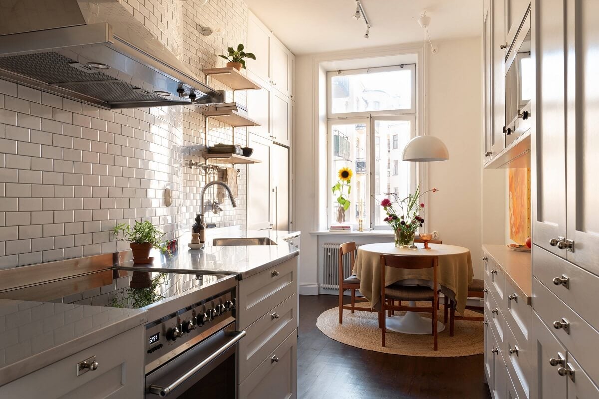 A Beautiful Turn-of-the-Century Apartment with Bold Color Accents 12 gray kitchen with round wooden table