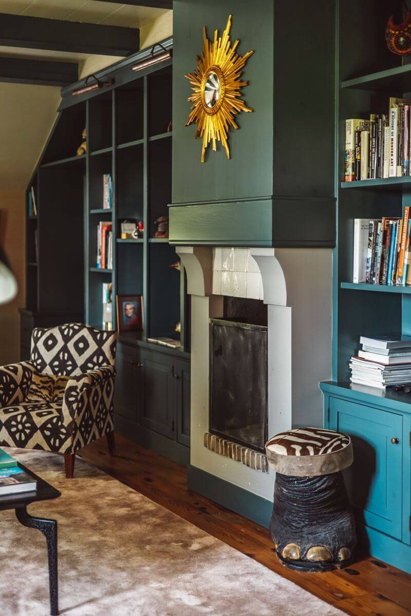 green sitting room fireplace bookcases