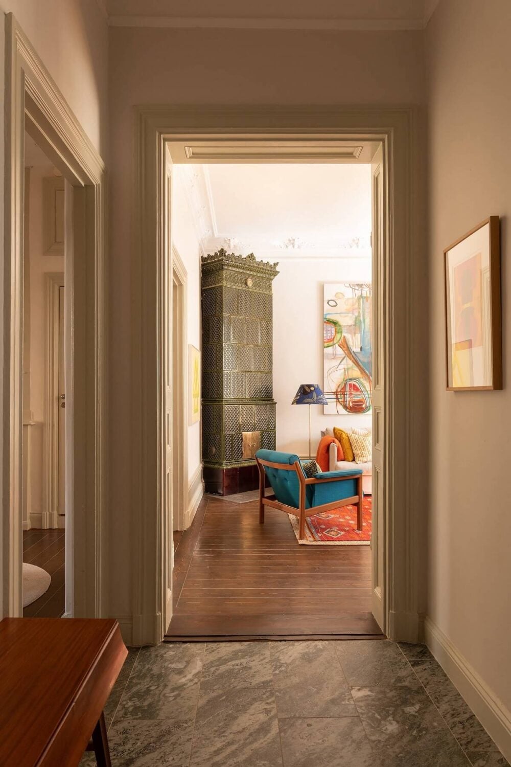 A Beautiful Turn-of-the-Century Apartment with Bold Color Accents 8 hallway with stone floor