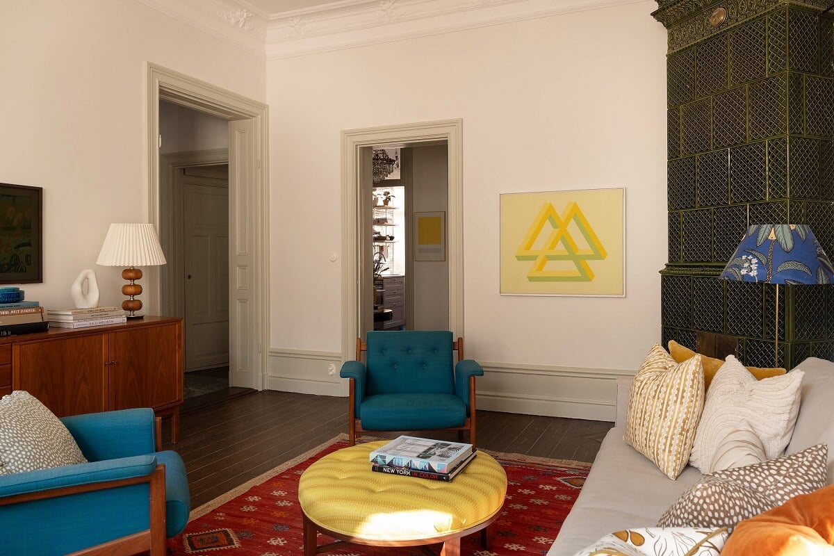 A Beautiful Turn-of-the-Century Apartment with Bold Color Accents 6 living room with blue chairs