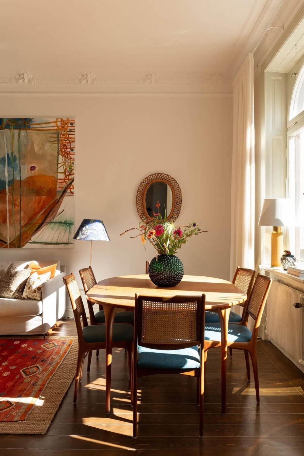 A Beautiful Turn-of-the-Century Apartment with Bold Color Accents 3 living room with dining table natural light