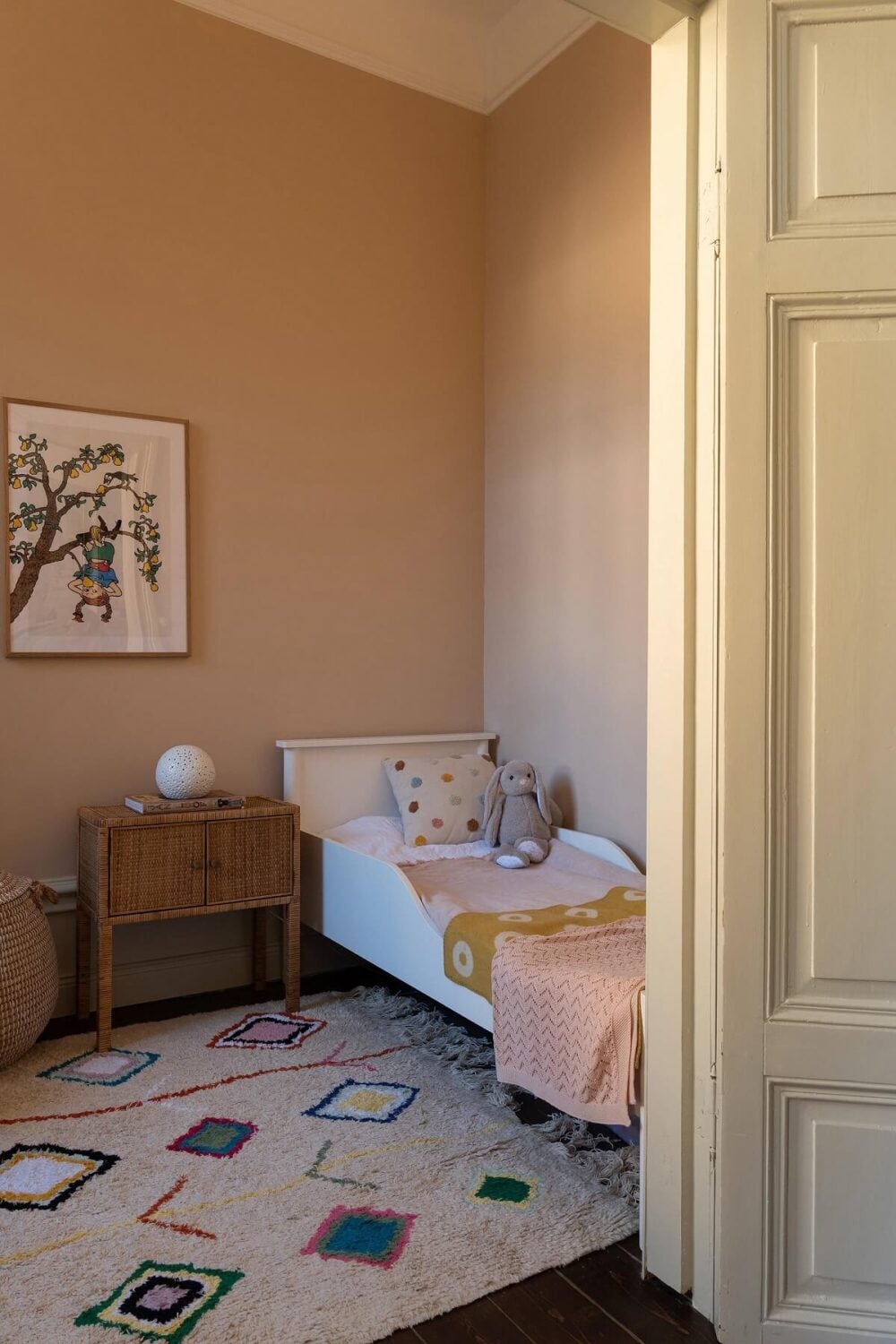 A Beautiful Turn-of-the-Century Apartment with Bold Color Accents 19 muted pink walls childrens bedroom